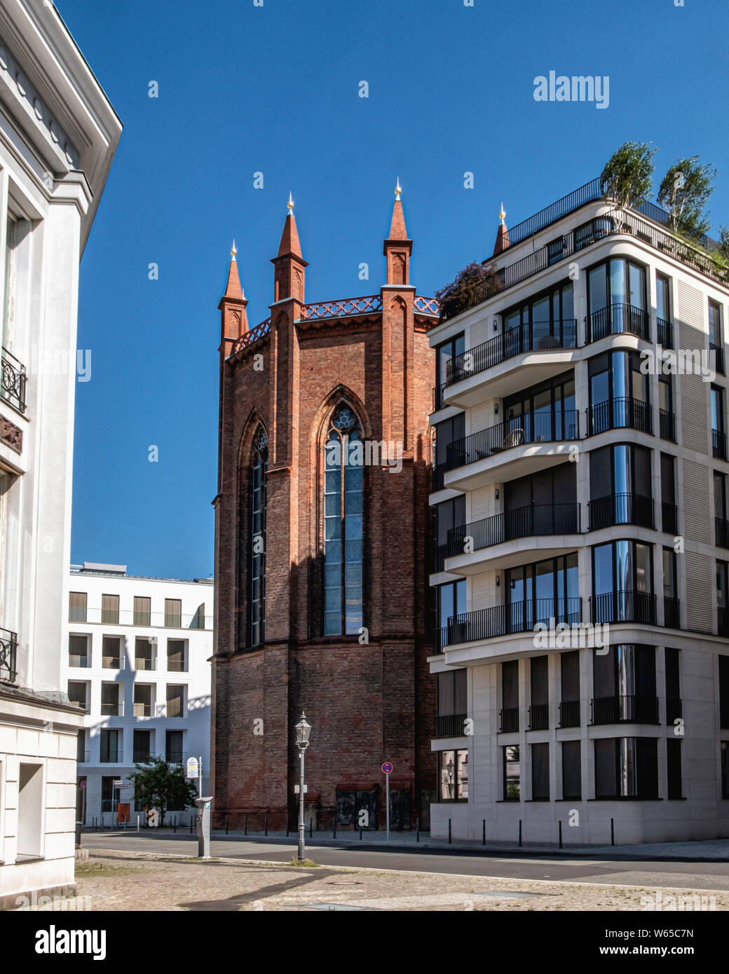 Berlin, Mitte. The beautiful Neo-gothic Friedrichswerder Church is closed as result of new building works around it. Poor city planning. Stock Photo