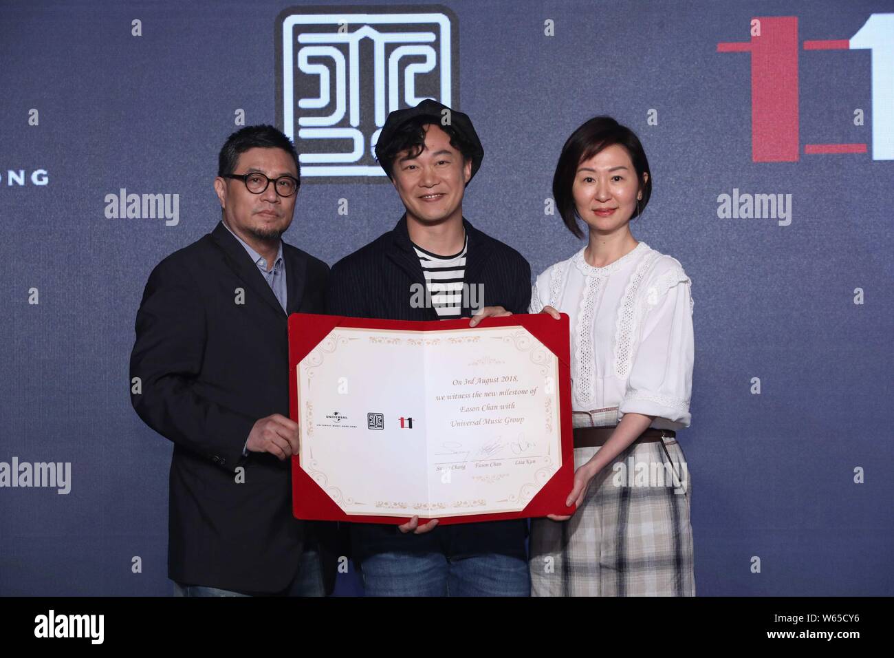 Hong Kong singer Eason Chan, center, attends a ceremony of Universal Music in Hong Kong, China, 3 August 2018. Stock Photo