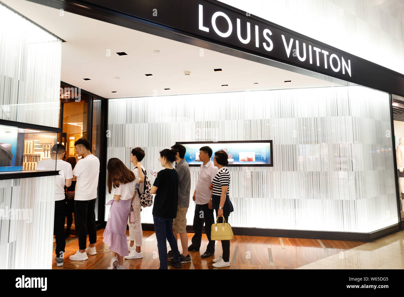 FILE--View of shoes showcased at a boutique of Louis Vuitton (LV) in Wuhan  city, central China's Hubei province, 6 June 2018. Perfume is playing Stock  Photo - Alamy