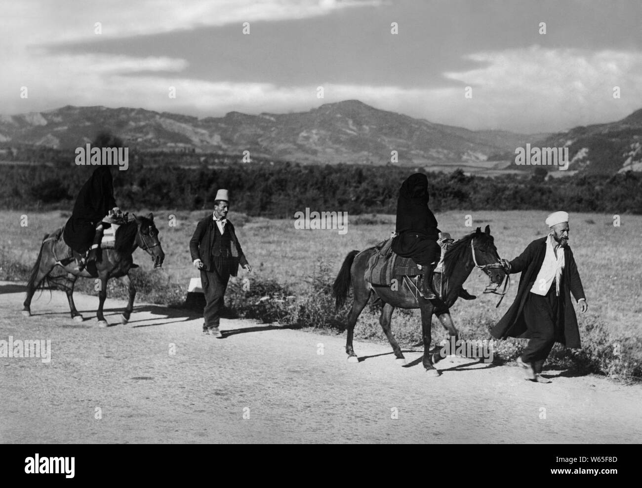 Albanian couples on horseback, 1942 Stock Photo