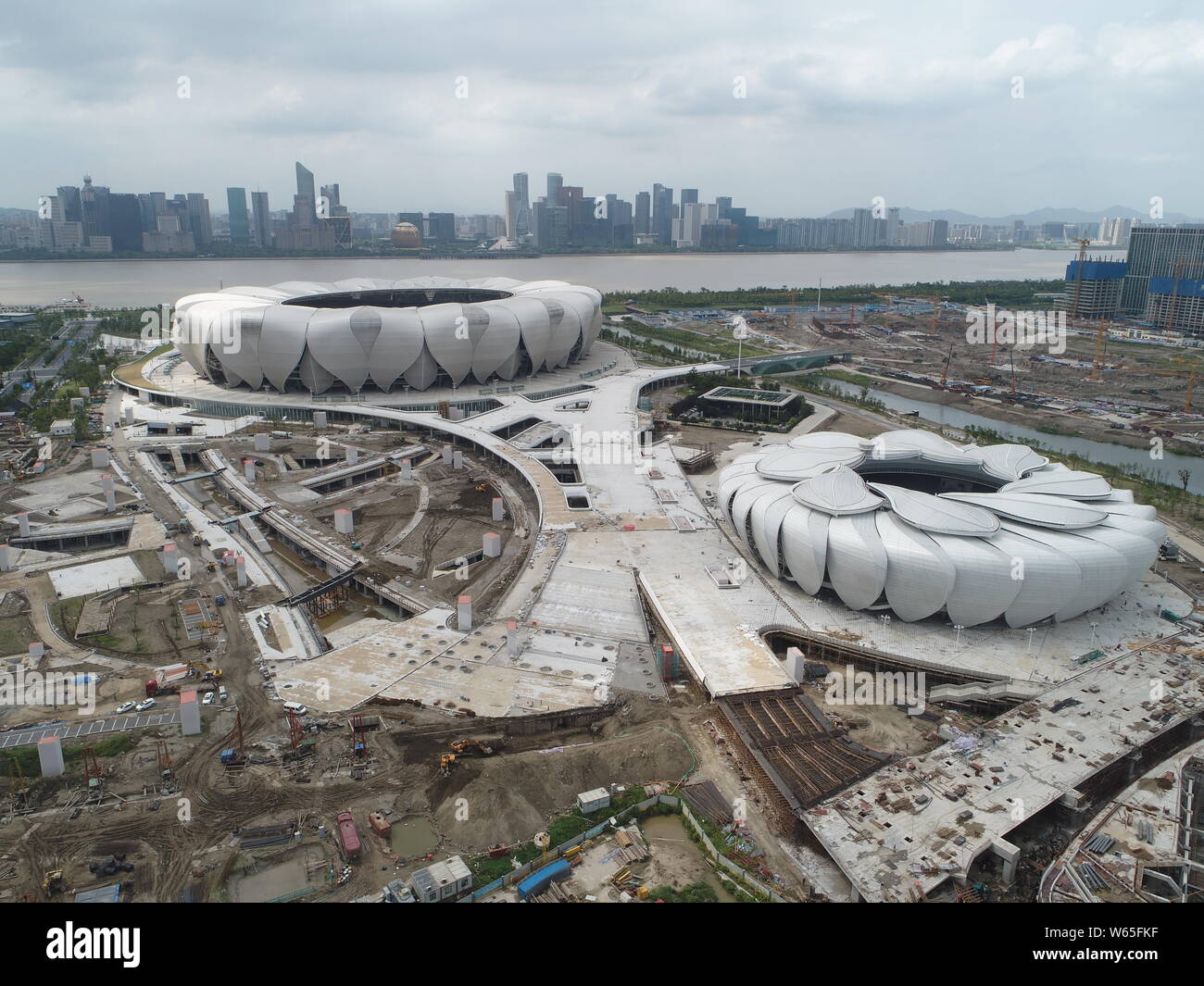 An aerial view of the main stadium, back, and the tennis center of the