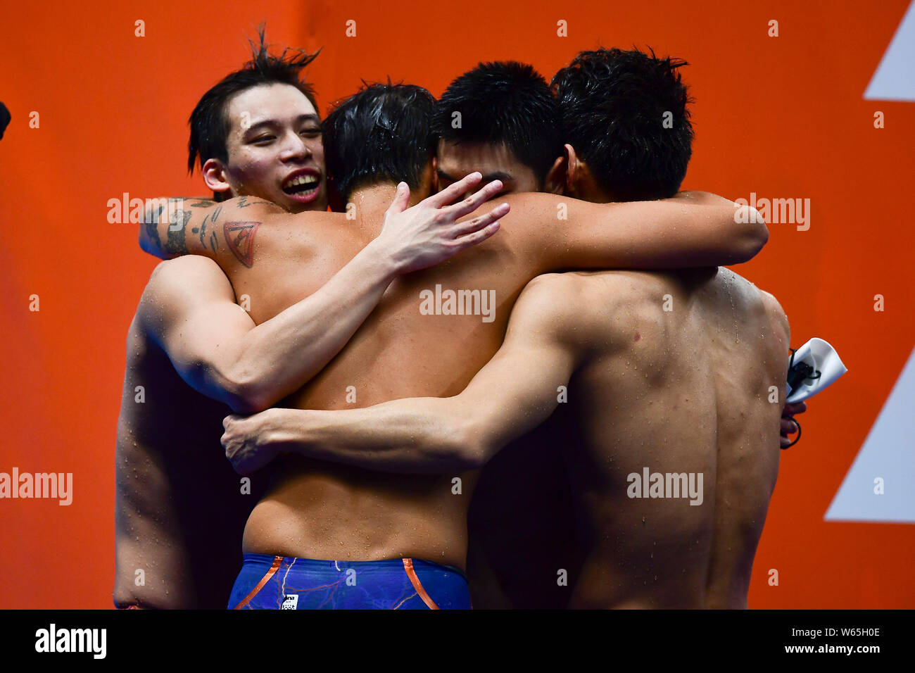 Chinese swimmers celebrate after winning the men's 4x100 medley relay swimming final during the 2018 Asian Games, officially known as the 18th Asian G Stock Photo