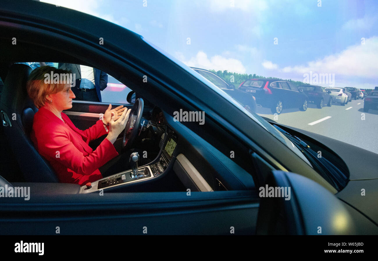 Stuttgart, Germany. 31st July, 2019. Nicole Hoffmeister-Kraut (CDU), Economics Minister of Baden-Württemberg, sits in the anteroom of the Stuttgart driving simulator of the Research Institute for Automotive Engineering and Vehicle Engines Stuttgart. Hoffmeister-Kraut wants to support the domestic automotive industry in the development of new technologies. Credit: Marijan Murat/dpa/Alamy Live News Stock Photo
