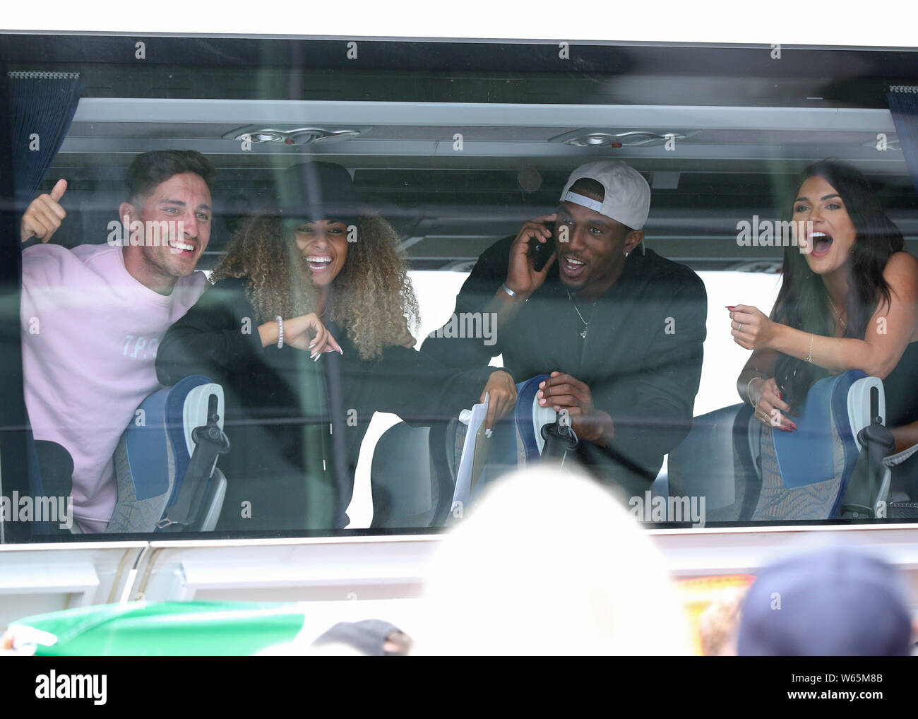 Love Island winners (left to right) Greg O'Shea and Amber Gill along with contestants Ovie Soko and India Reynolds arrive at Stansted Airport in Essex following the final of the reality TV show. Stock Photo