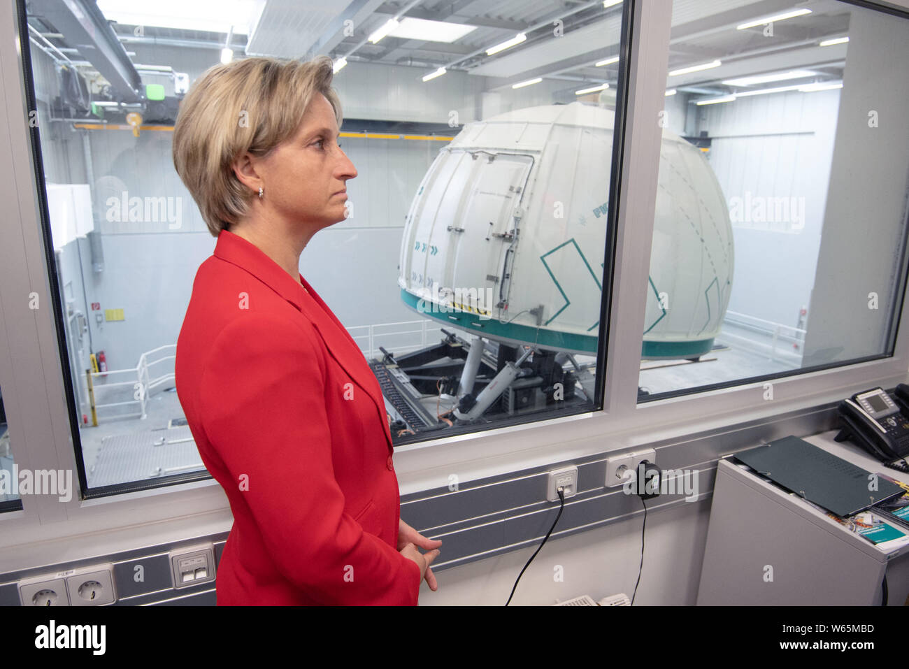 Stuttgart, Germany. 31st July, 2019. Nicole Hoffmeister-Kraut (CDU), Economics Minister of Baden-Württemberg, stands in the anteroom of the Stuttgart driving simulator of the Research Institute for Automotive Engineering and Vehicle Engines Stuttgart. Hoffmeister-Kraut wants to support the domestic automotive industry in the development of new technologies. Credit: Marijan Murat/dpa/Alamy Live News Stock Photo