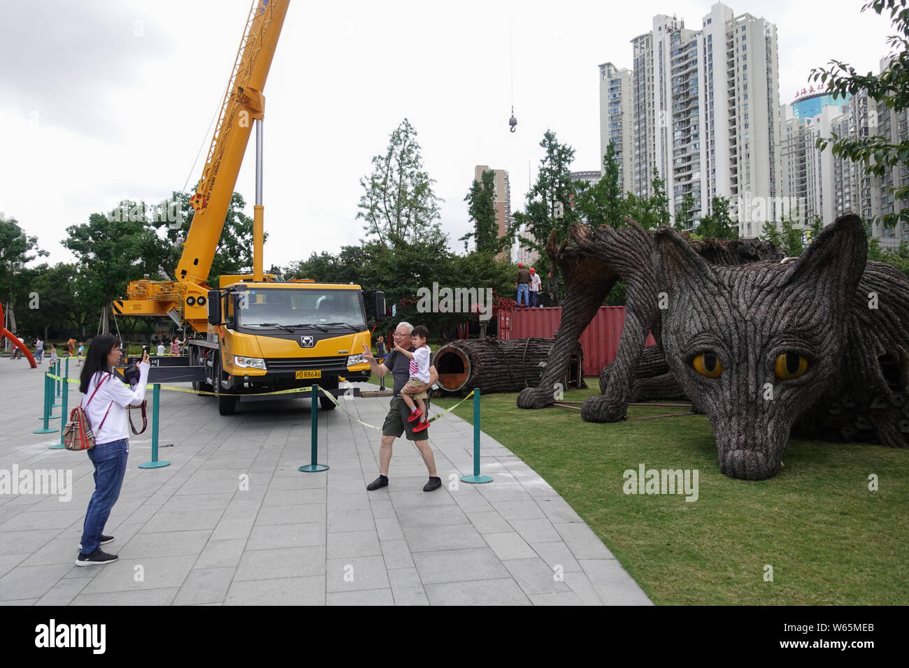 The 7-meter- high and 10-meter-long metal-and-straw sculpture 'Urban Fox' is being dismantled at Jing'an Sculpture Park in Shanghai, China, 15 August Stock Photo