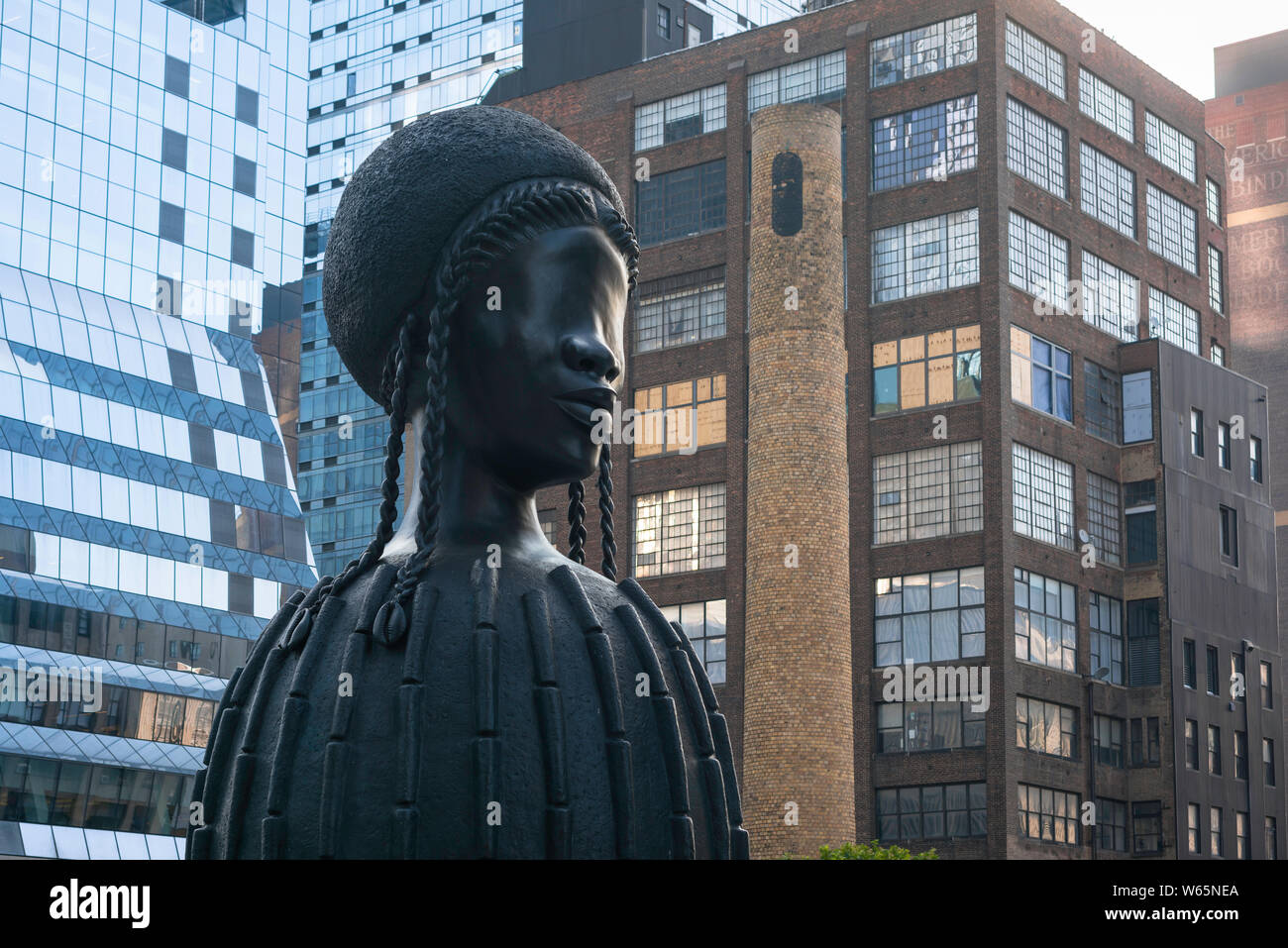 View of the monumental sculpture titled Brick House, by Simone Leigh, sited on the High Line in the Chelsea area of Manhattan, New York City, USA. Stock Photo