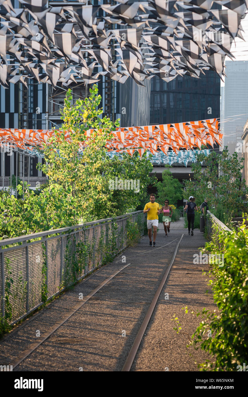 High Line New York, view of a man running on the High Line in downtown Manhattan, New York City, USA Stock Photo