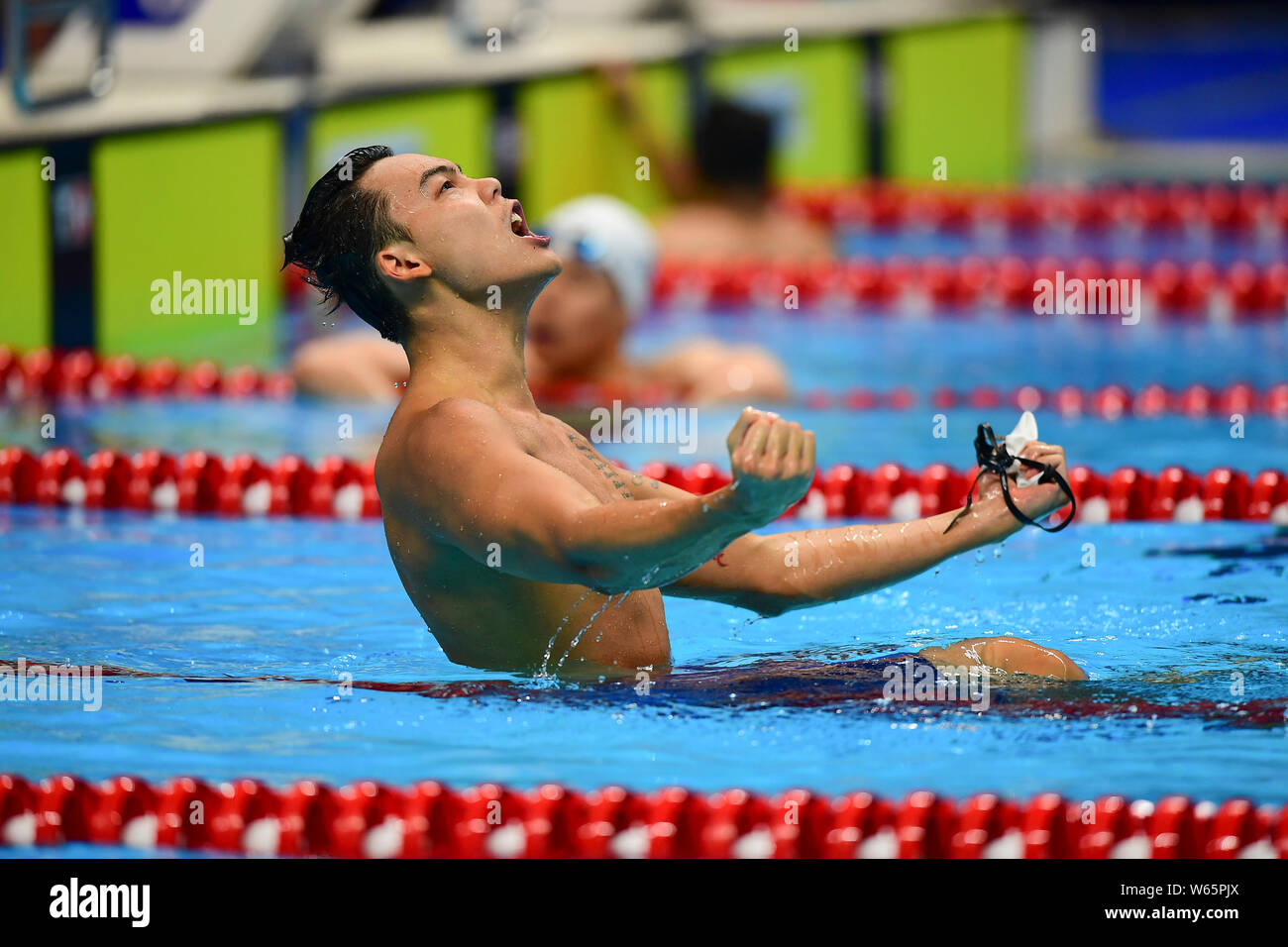 Yu Hexin Of China Reacts After Winning The Men S 4x100 Medley Relay Swimming Final During The 2018 Asian Games Officially Known As The 18th Asian Gam Stock Photo Alamy