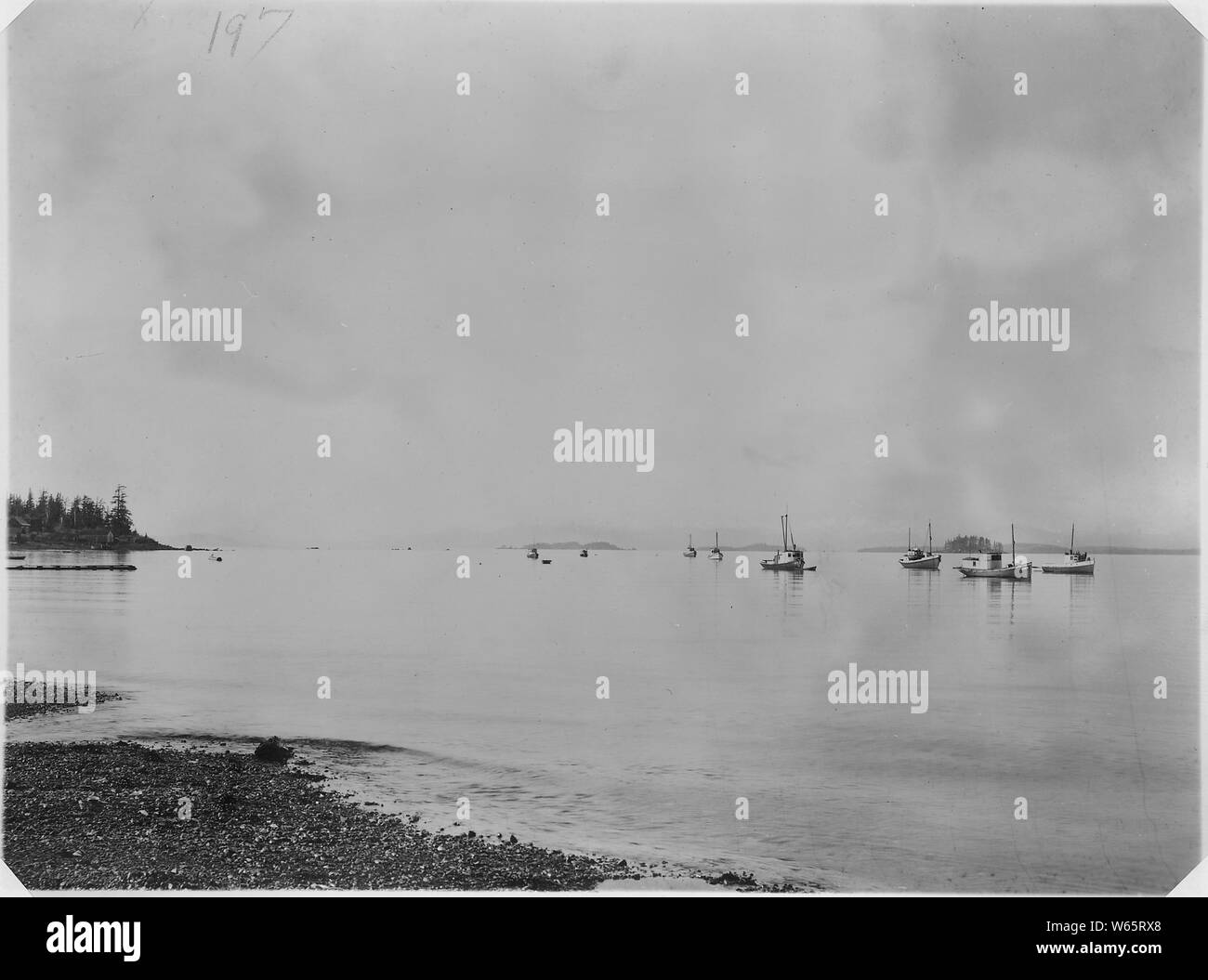 Group of fishing boats in bay Stock Photo - Alamy