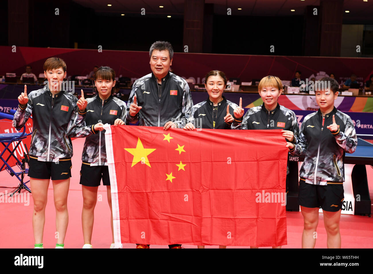 Players Of China Team Pose With The National Flag After Defeating