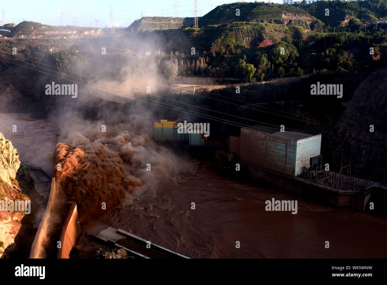 Water gushes out from the Liujiaxia Hydroelectric Station for flood control on the Yellow River in Yongjing county, Linxia Hui Autonomous Prefecture, Stock Photo