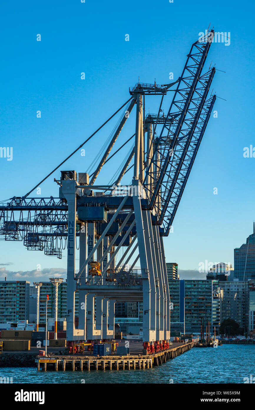 Row of container cranes sitting idle in Auckland harbour Stock Photo
