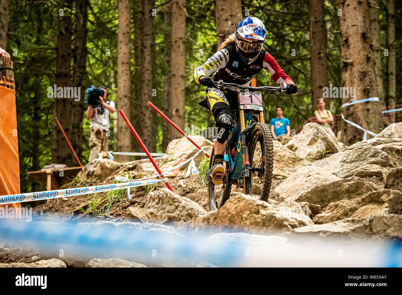 Rachel Atherton (GBR) racing at the UCI Mountain Bike Downhill World Cup. Wearing leaders jersey. Stock Photo