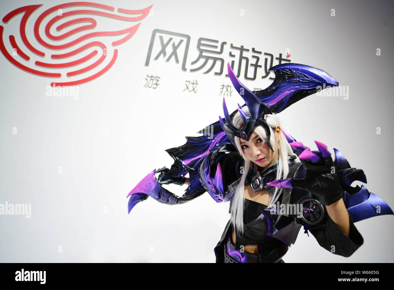 https://c8.alamy.com/comp/W6605G/file-a-chinese-showgirl-poses-at-the-stand-of-netease-games-during-the-16th-china-digital-entertainment-expo-also-known-as-chinajoy-2018-in-shang-W6605G.jpg