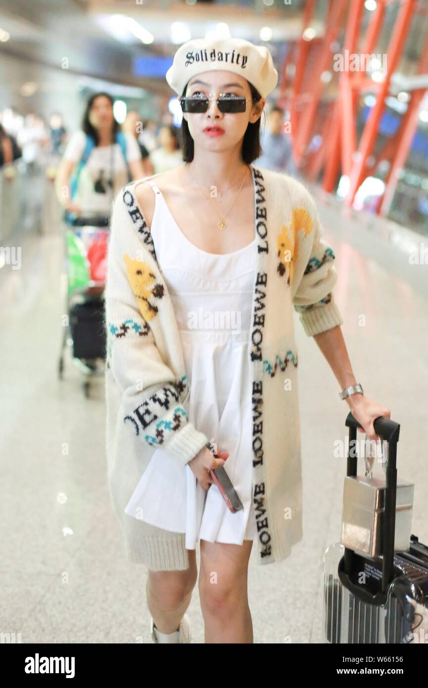 Chinese singer and actress Victoria Song or Song Qian arrives at the Beijing Capital International Airport in Beijing, China, 29 August 2018.   Cardig Stock Photo