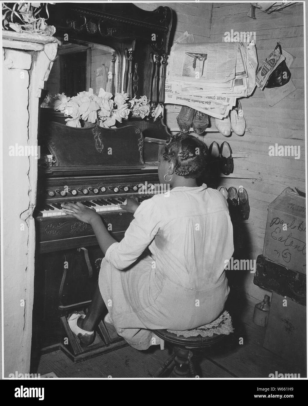 Harmony Community, Putnam County, Georgia. These pictures show the interior of a young tenant's plac . . .; Scope and content:  Full caption reads as follows: Harmony Community, Putnam County, Georgia. These pictures show the interior of a young tenant's place. Pump organs like this one are surprisingly common. Stock Photo