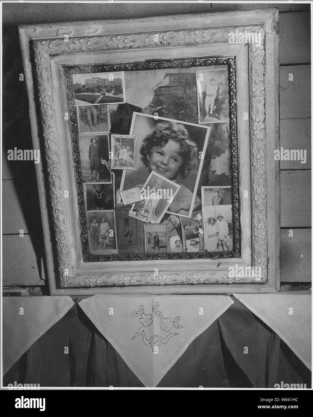 Harmony Community, Putnam County, Georgia. These pictures show another tenant's place. There is an o . . .; Scope and content:  Full caption reads as follows: Harmony Community, Putnam County, Georgia. These pictures show another tenant's place. There is an organ here too. (This image] is interesting - Shirley Temple surrounded by the friends and relatives of the residents. Stock Photo