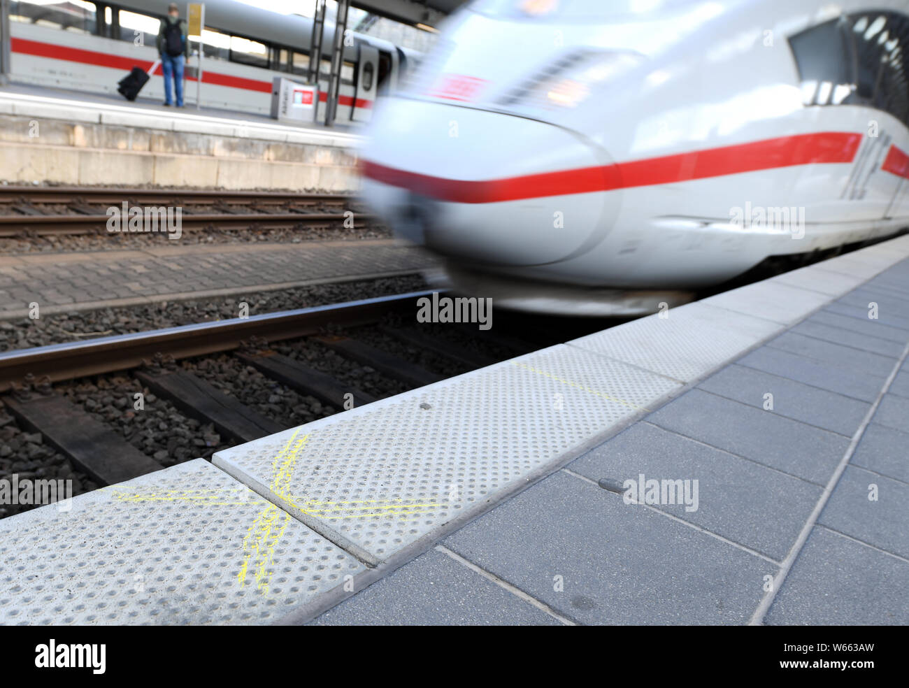 31 July 2019, Hessen, Frankfurt/Main: An ICE train passes a marked point on track 7 of the main station. An eight-year-old boy was pushed and killed here on 29 July by a man in front of an ICE train. Photo: Arne Dedert/dpa Stock Photo