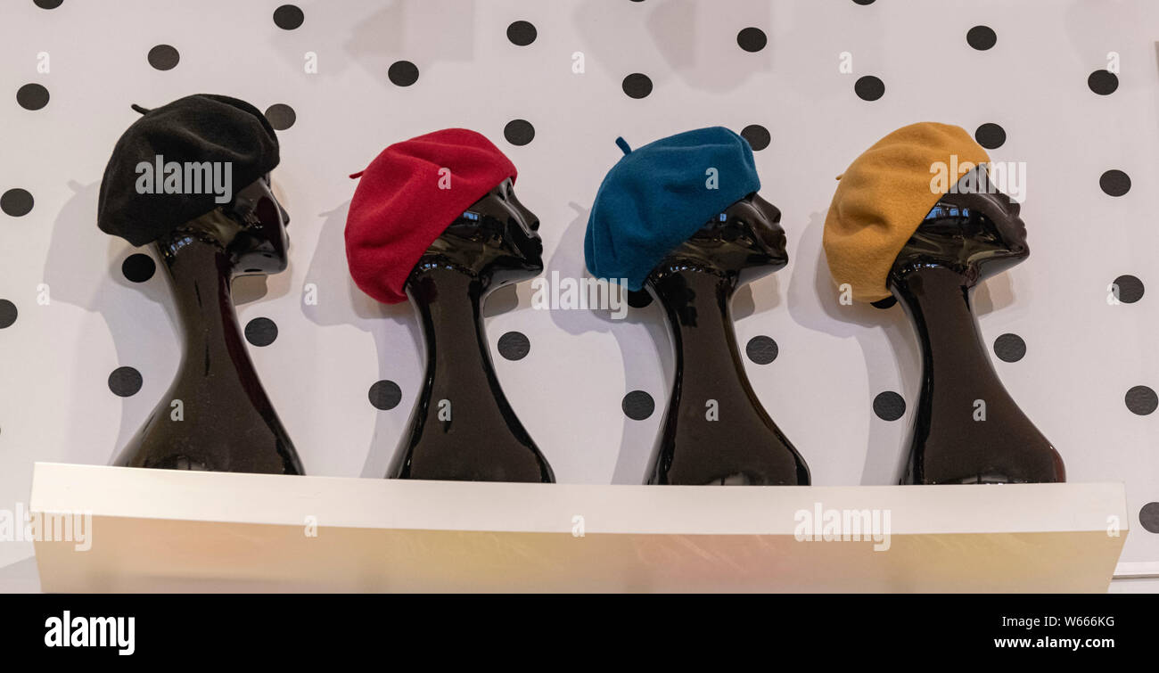 Colourful berets on head mannequins part of Mary Quant Exhibition at V & A Museum, Cromwell Road, London SW7 UK Stock Photo