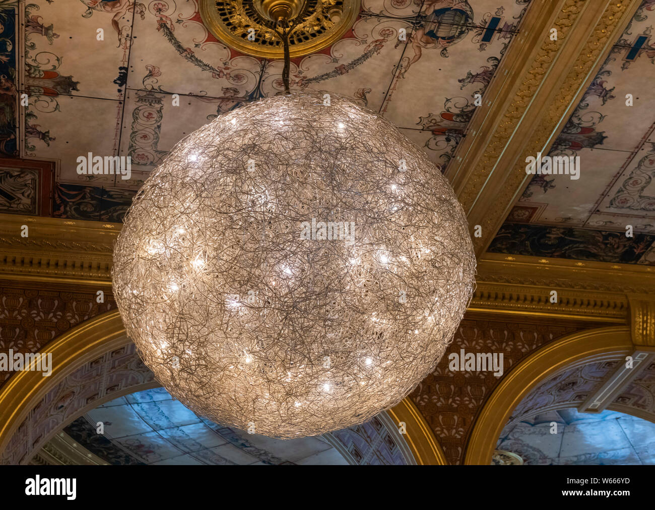 Ornate Italianate ceiling light in The Gamble Room cafe at V & A Museum Cromwell Road, London SW7 UK Stock Photo
