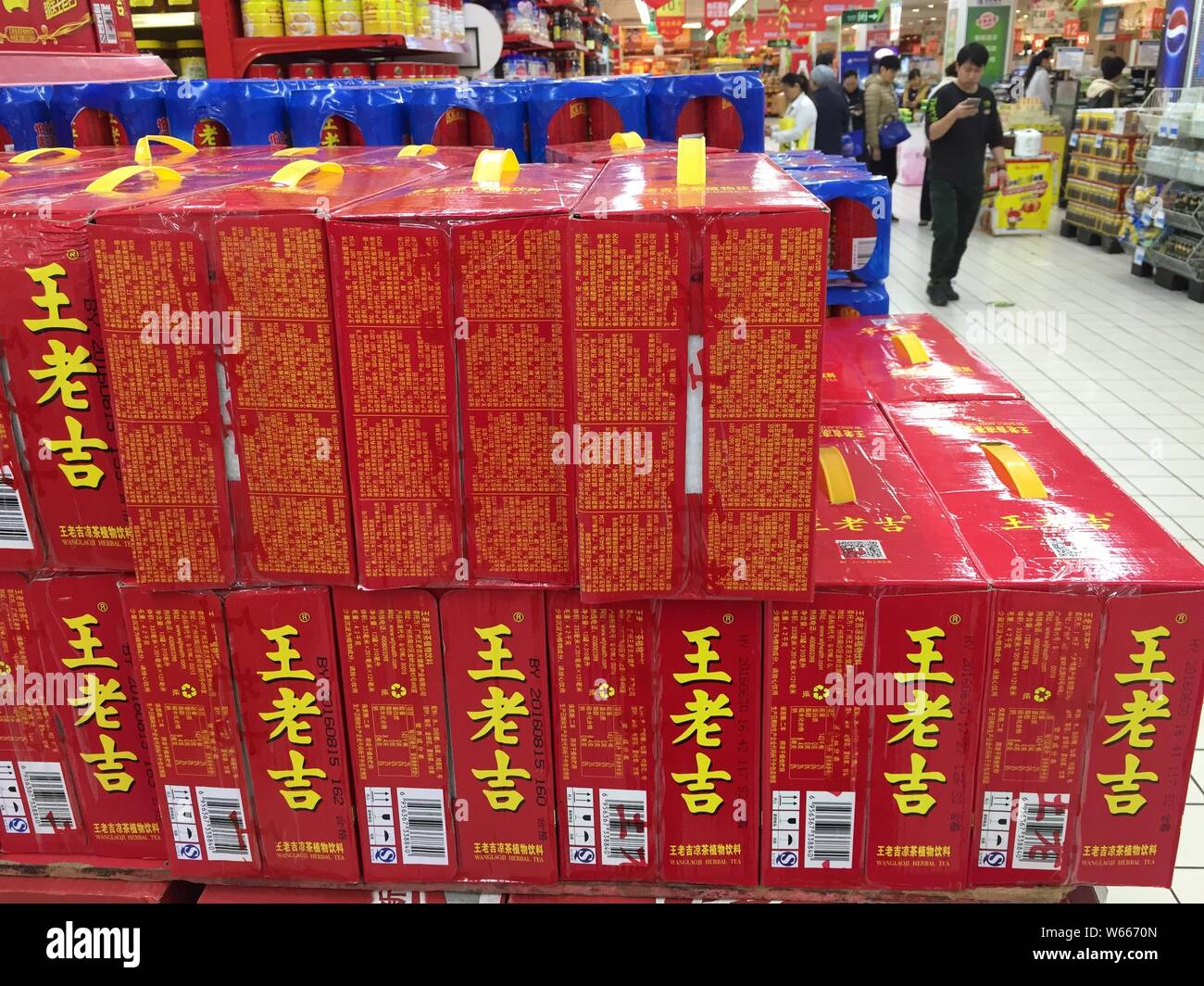 --FILE--Boxes of Wong Lo Kat herbal tea of Guangzhou Pharmaceutical Holding Limited are for sale in Shanghai, China, 22 March 2017.   Guangzhou Wang L Stock Photo