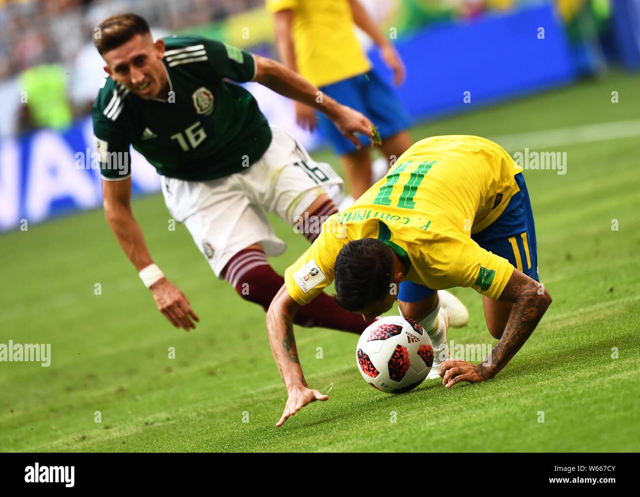 Philippe Coutinho of Brazil, right, challenges Hector Herrera of Mexico in their Round of 16 match during the 2018 FIFA World Cup in Samara, Russia, 2 Stock Photo