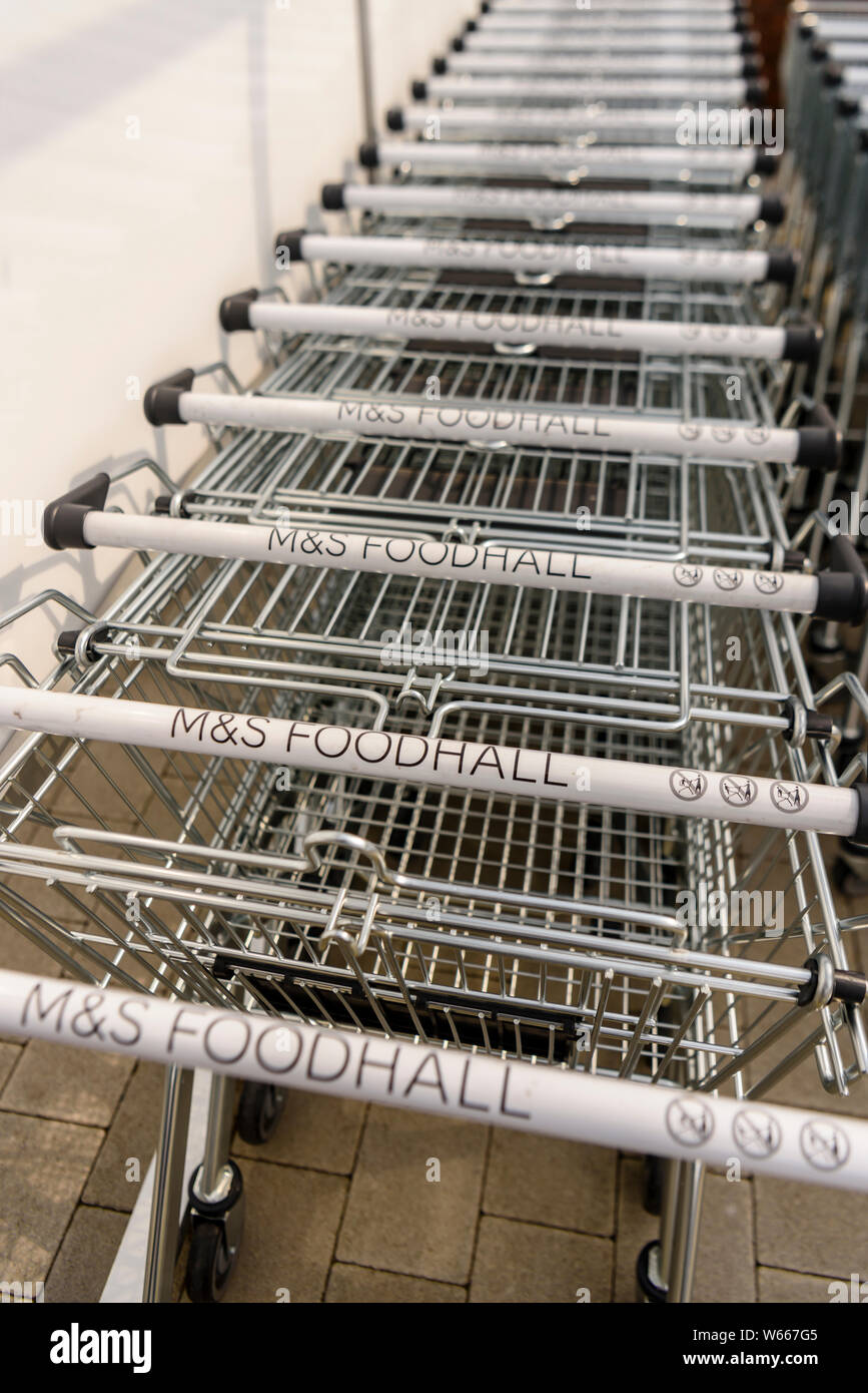 Trollies outside a Marks and Spencers Foodhall. Stock Photo