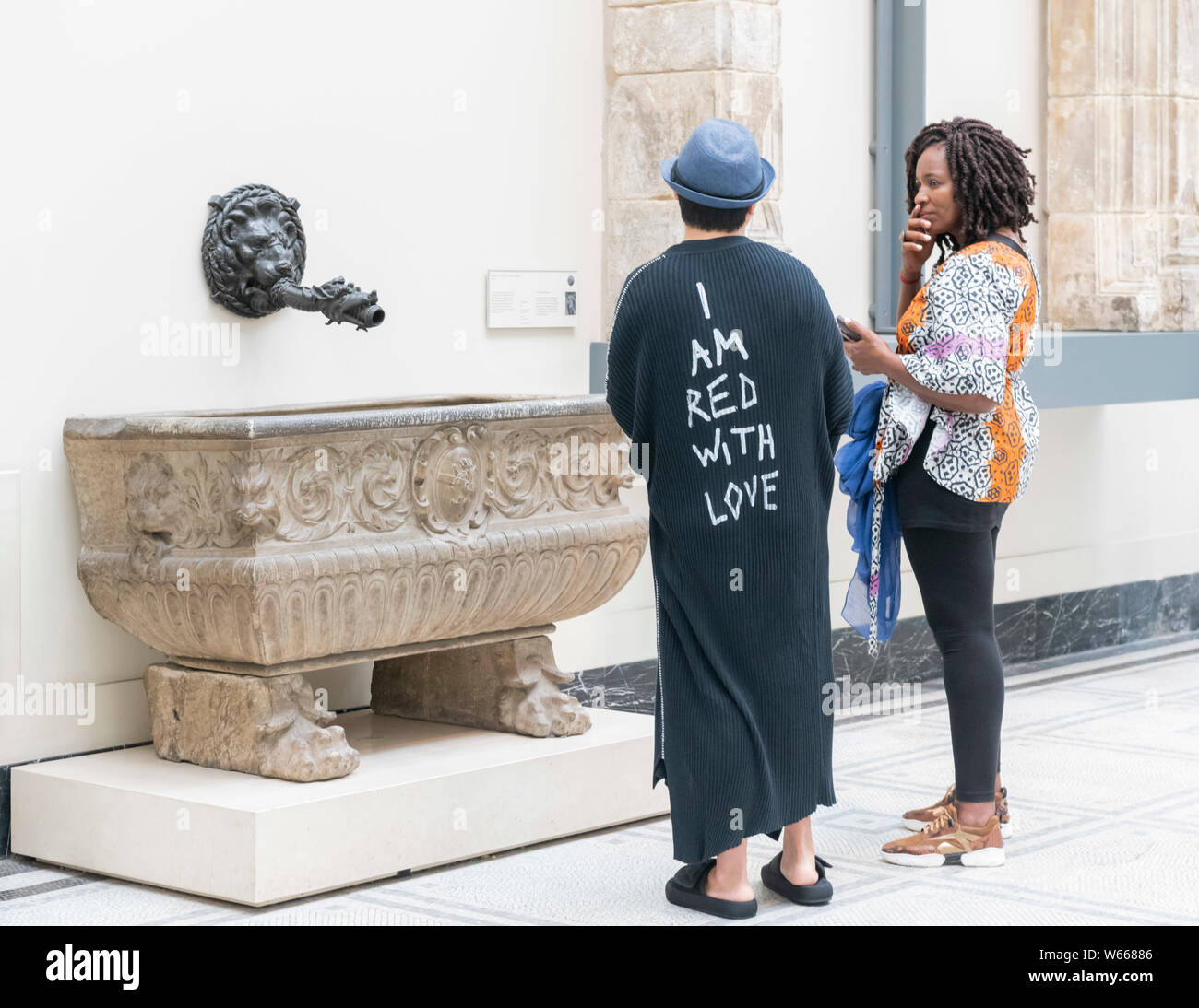 Two people admiring sculptures in Paul & Jill Ruddock Gallery, V & A Museum, Cromwell Road London SW7 UK Stock Photo