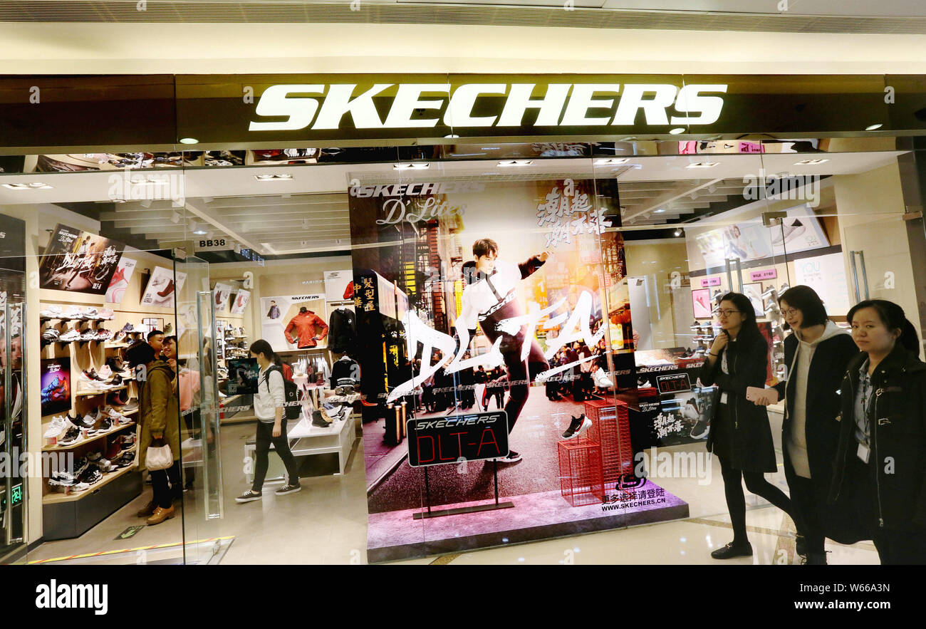 FILE--Customers walk past a branch of Global athleisure brand SKECHERS in  Beijing, China, 1 November 2017. Global athleisure brand SKECHERS has se  Stock Photo - Alamy