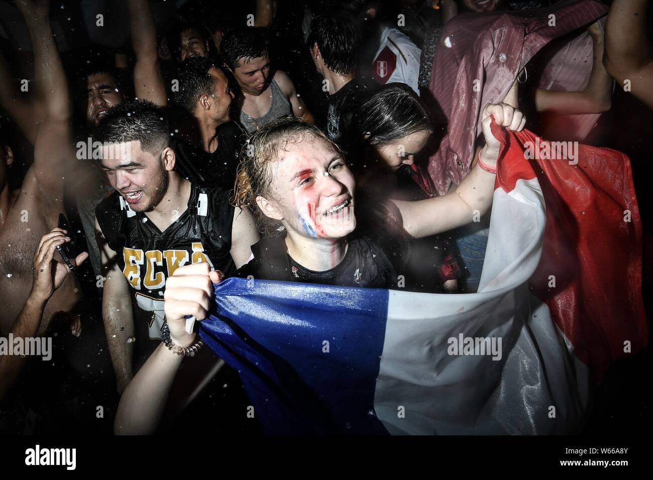 French fans react as they watch the game on a square after France ...