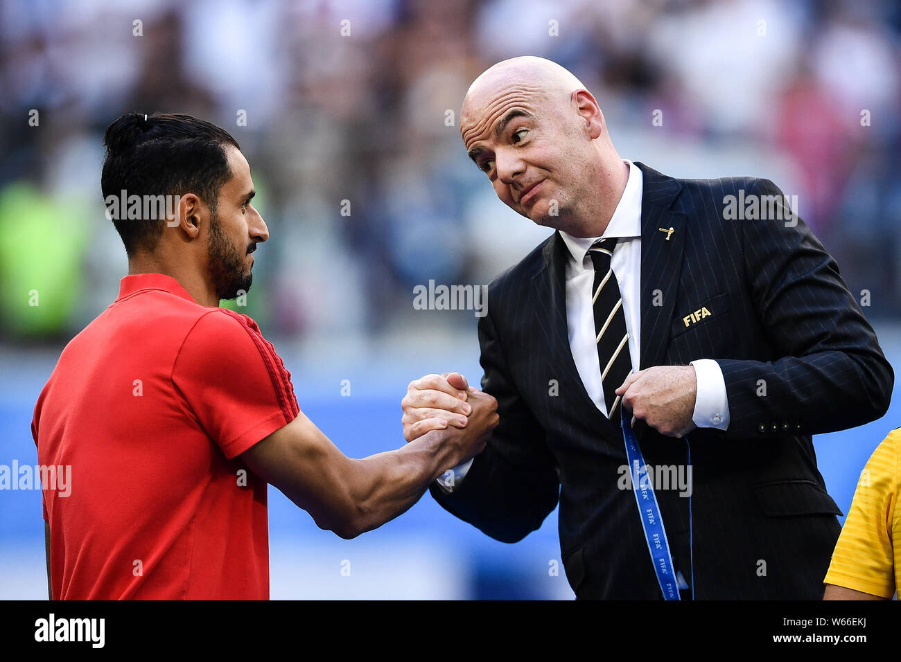 FIFA president Gianni Infantino, right, awards Nacer Chadli of Belgium after Belgium defeated England in their third place match during the 2018 FIFA Stock Photo