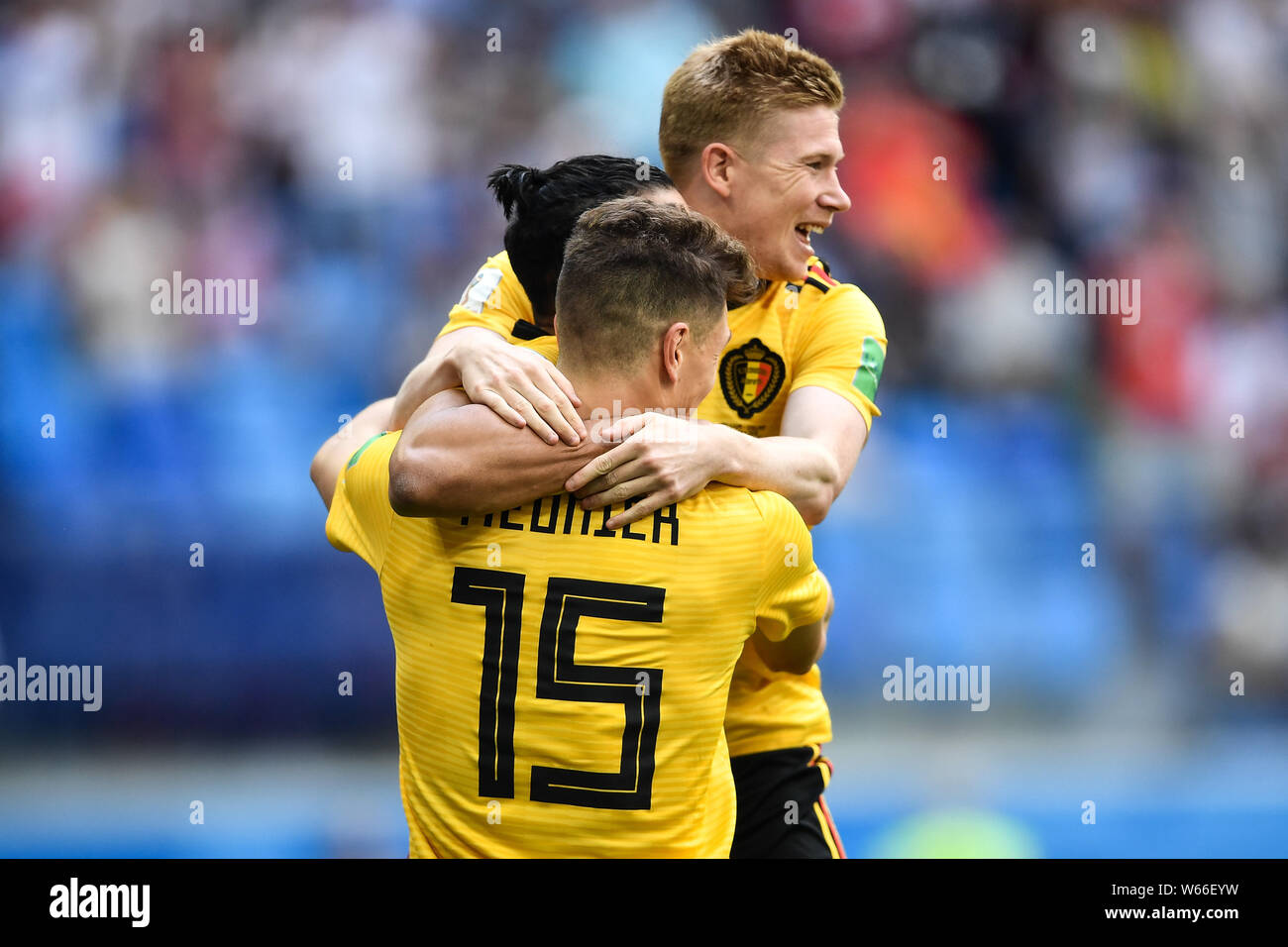 Thomas Meunier, front, of Belgium celebrates with Nacer Chadli, center, and Kevin De Bruyne after scoring Belgium's first goal against England in thei Stock Photo