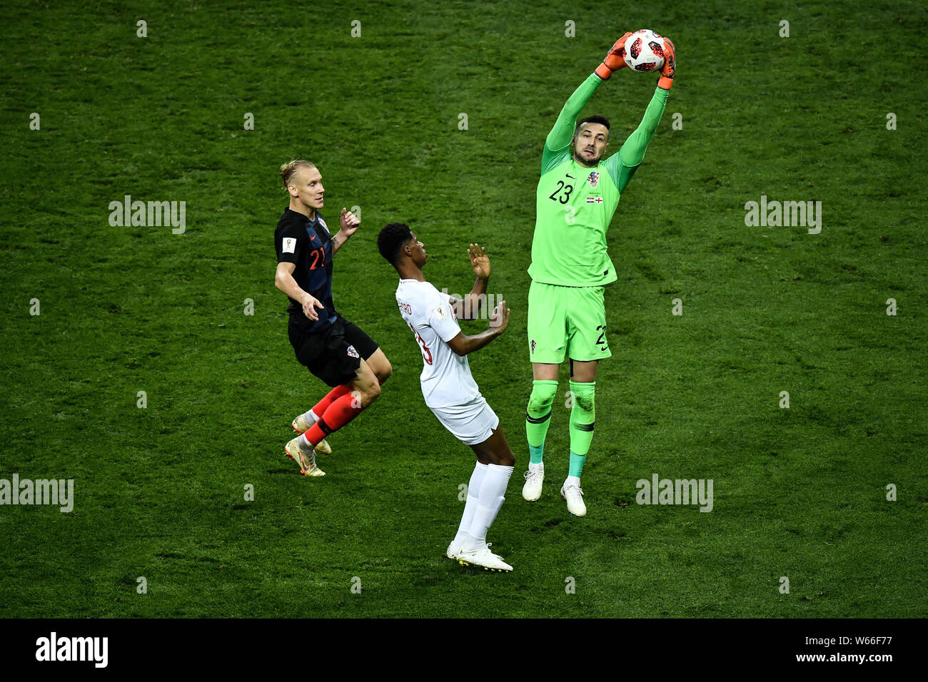 Goalkeeper Danijel Subasic of Croatia, right, saves the ball in front of Marcus Rashford of England in their semifinal match during the 2018 FIFA Worl Stock Photo