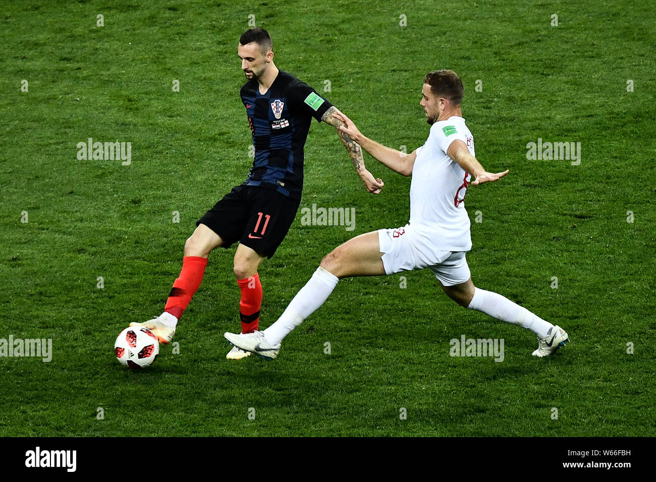 Jordan Henderson of England, right, challenges Marcelo Brozovic of Croatia in their semifinal match during the 2018 FIFA World Cup in Moscow, Russia, Stock Photo