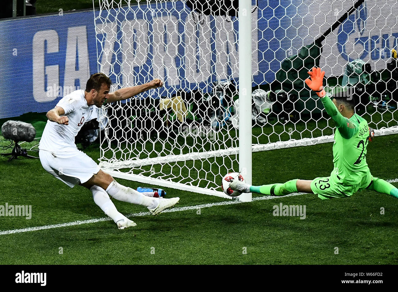 Goalkeeper Danijel Subasic of Croatia, right, tries to block a shot by Harry Kane of England in their semifinal match during the 2018 FIFA World Cup i Stock Photo