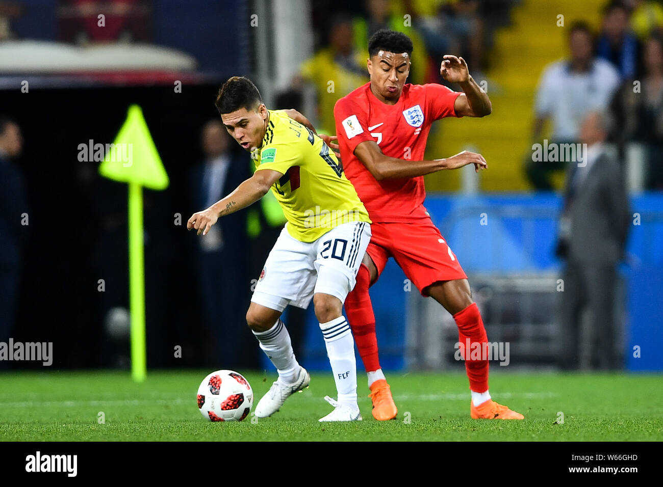 Jesse Lingard of England, right, challeges Juan Fernando Quintero of Columbia in their Round of 16 match during the 2018 FIFA World Cup in Moscow, Rus Stock Photo