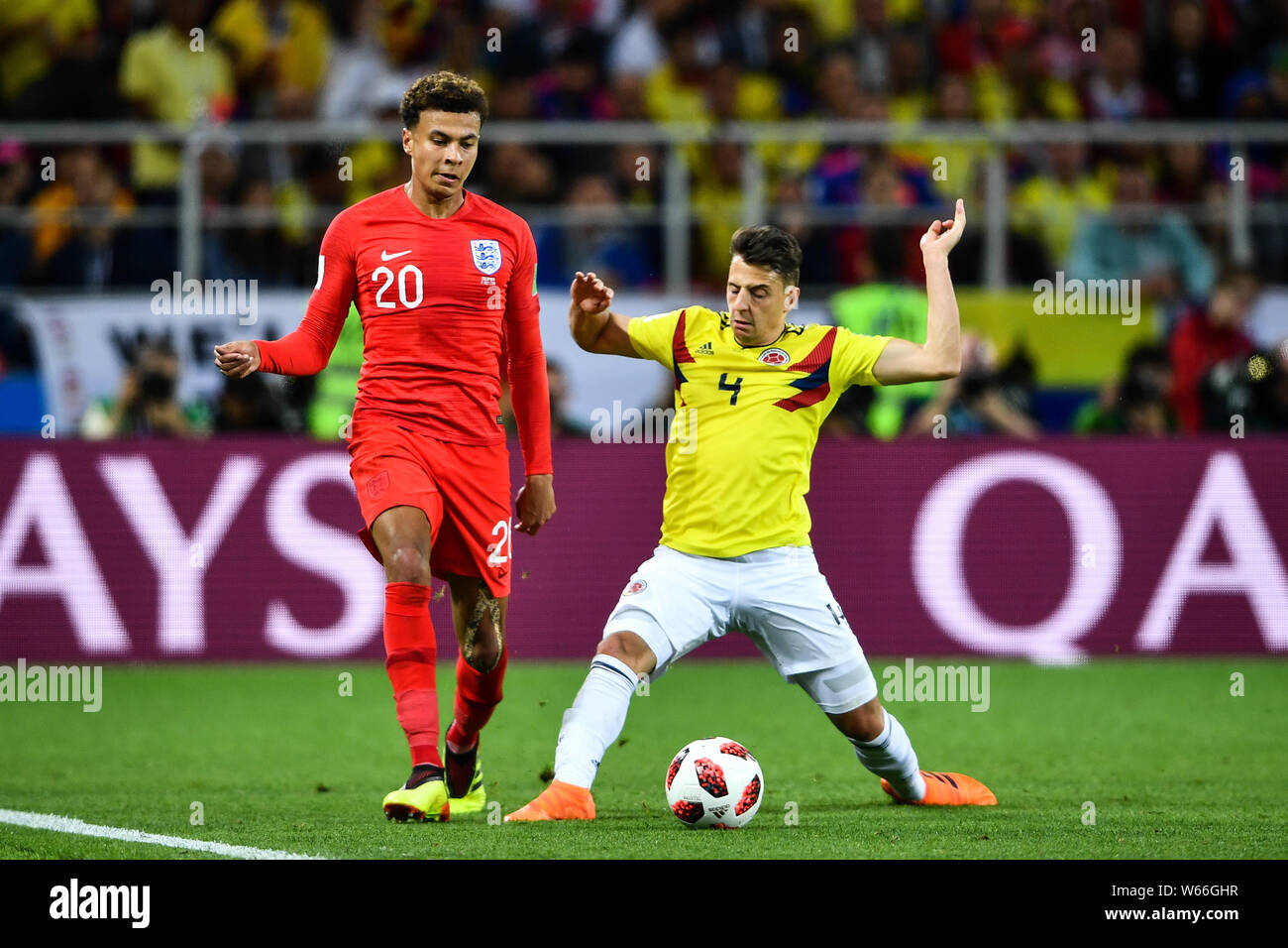 Santiago Arias of England, right, challenges Dele Alli of Columbia in their Round of 16 match during the 2018 FIFA World Cup in Moscow, Russia, 3 July Stock Photo