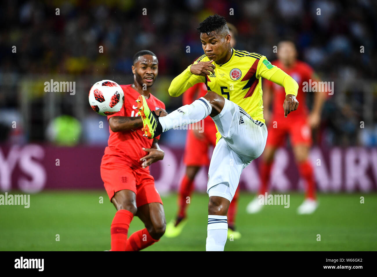 Wilmar Barrios of Columbia, right, challenges a player of England in their Round of 16 match during the 2018 FIFA World Cup in Moscow, Russia, 3 July Stock Photo