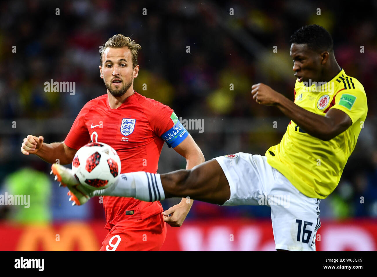 Jefferson Lerma of Columbia, right, challenges Jordan Henderson of England in their Round of 16 match during the 2018 FIFA World Cup in Moscow, Russia Stock Photo