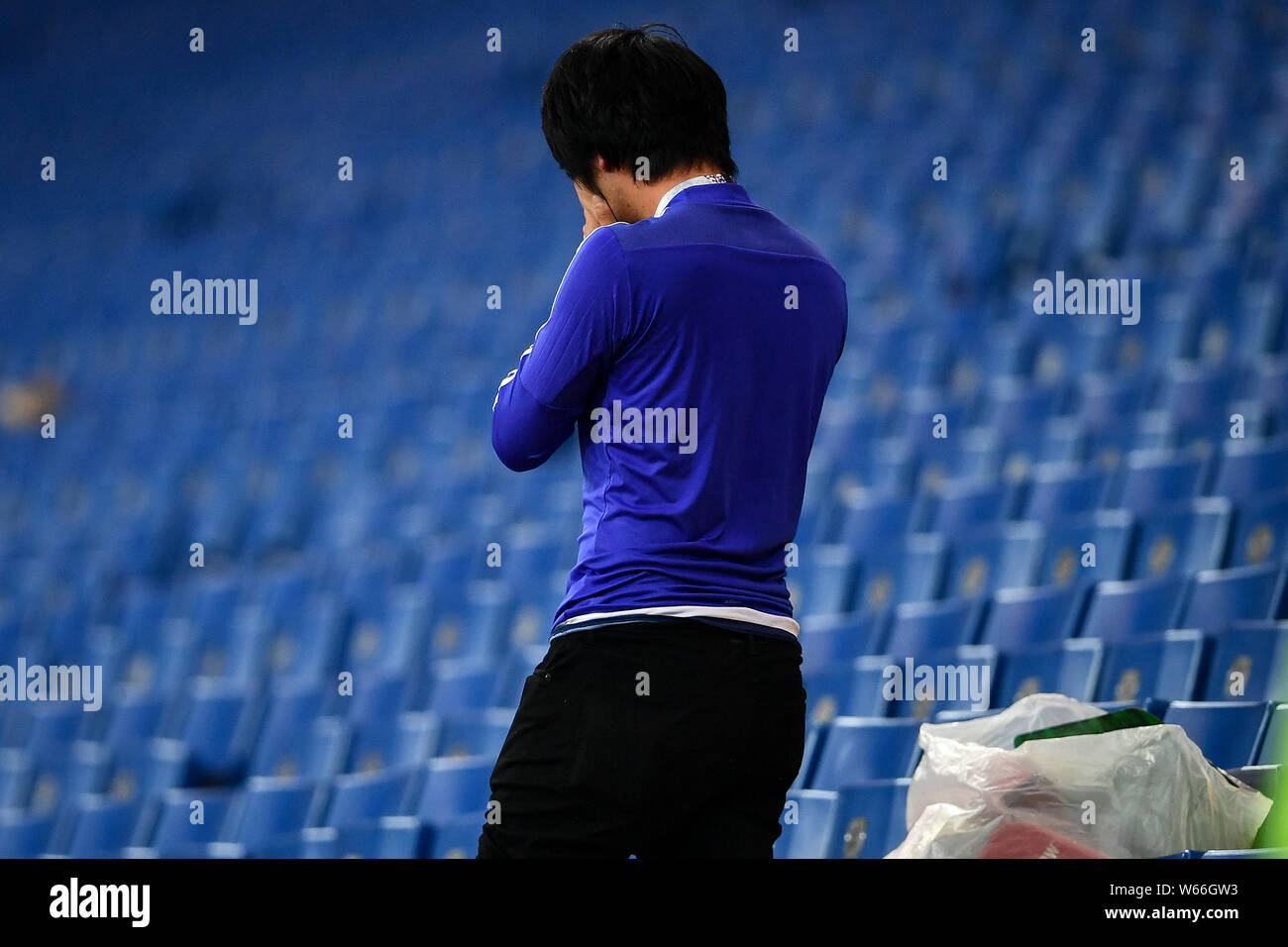 A Heartbroken Japanese Fan Weeps As He Cleans The Stadium s Stand After 
