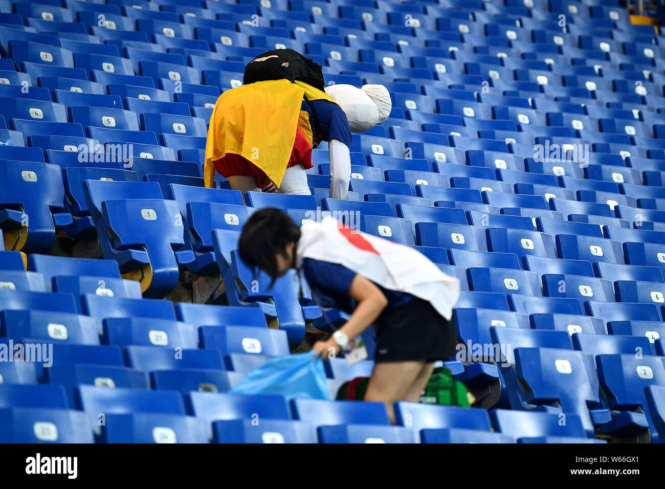 Heartbroken Japanese Fans Clean The Stadiums Stand After Japan Was Defeated By Belgium In The 1009