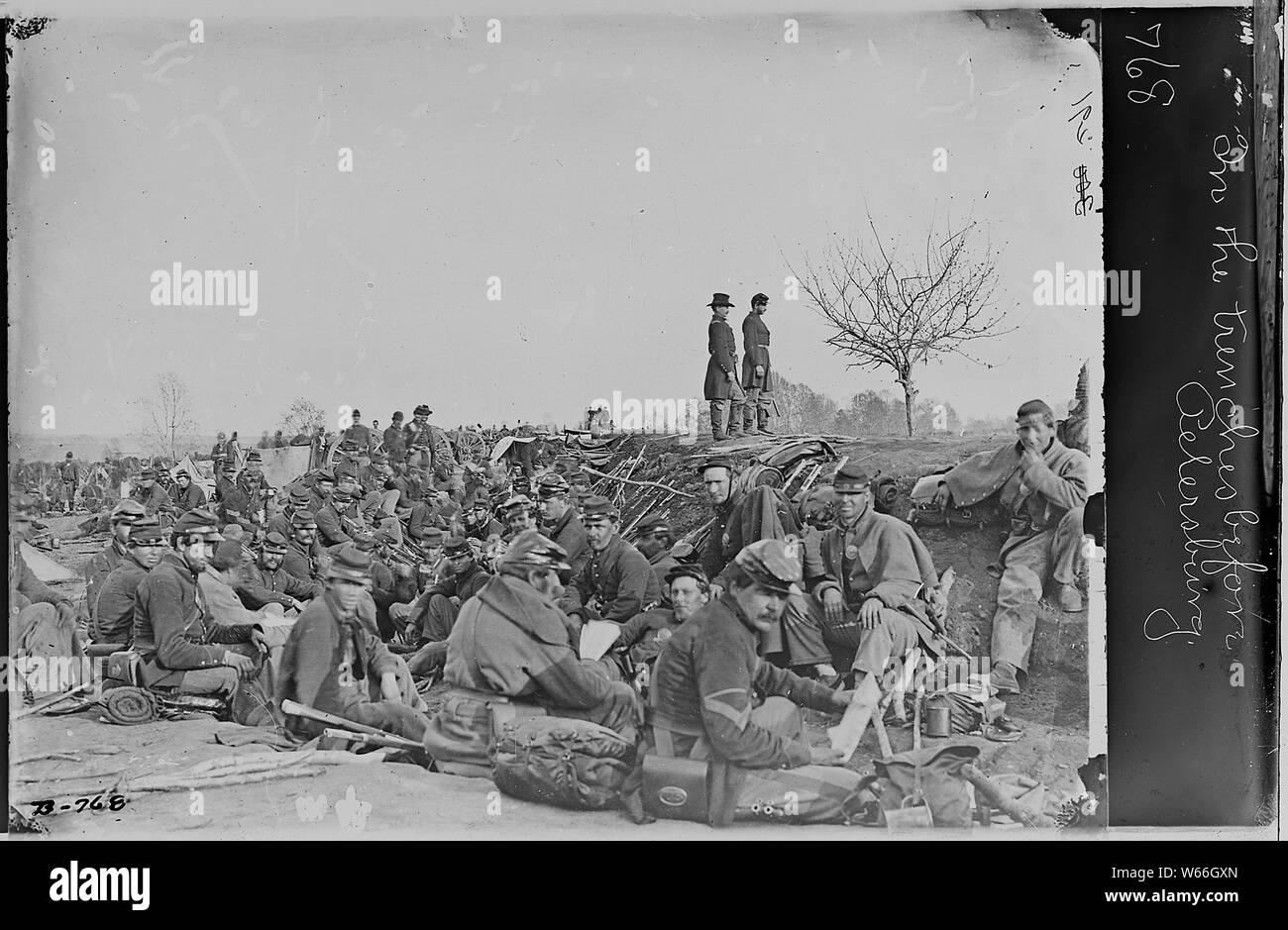In the trenches before Petersburg, Va; General notes:  The Petersburg identification appearing in the official caption received by NARA from the Army Signal Corps, and appearing as well in the 1897 War Department Library Catalogue, based presumably on rough captioning that came to the War Department from the Mathew Brady Studio when the War Department purchased the glass negatives from Brady in 1874-1875, has been disputed by Civil War historians and photo-historians for a number of years. In the early 1980s, research by Larry Strayer, Brian Pohanka, Harris Andrews, and William Frassanito unco Stock Photo