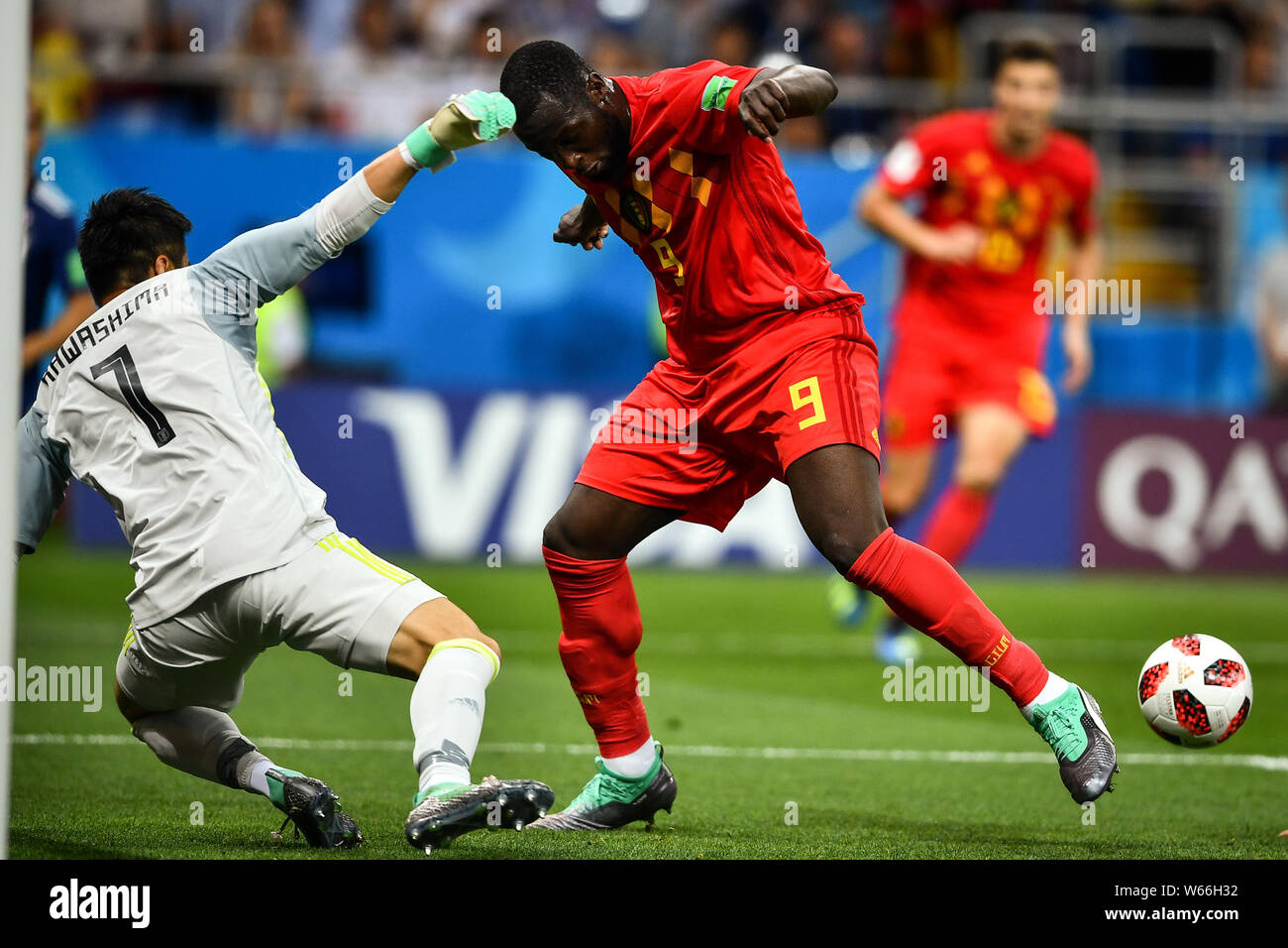 Romelu Lukaku of Belgium, right, challenges Eiji Kawashima of Japan in their Round of 16 match during the 2018 FIFA World Cup in Rostov, Russia, 2 Jul Stock Photo