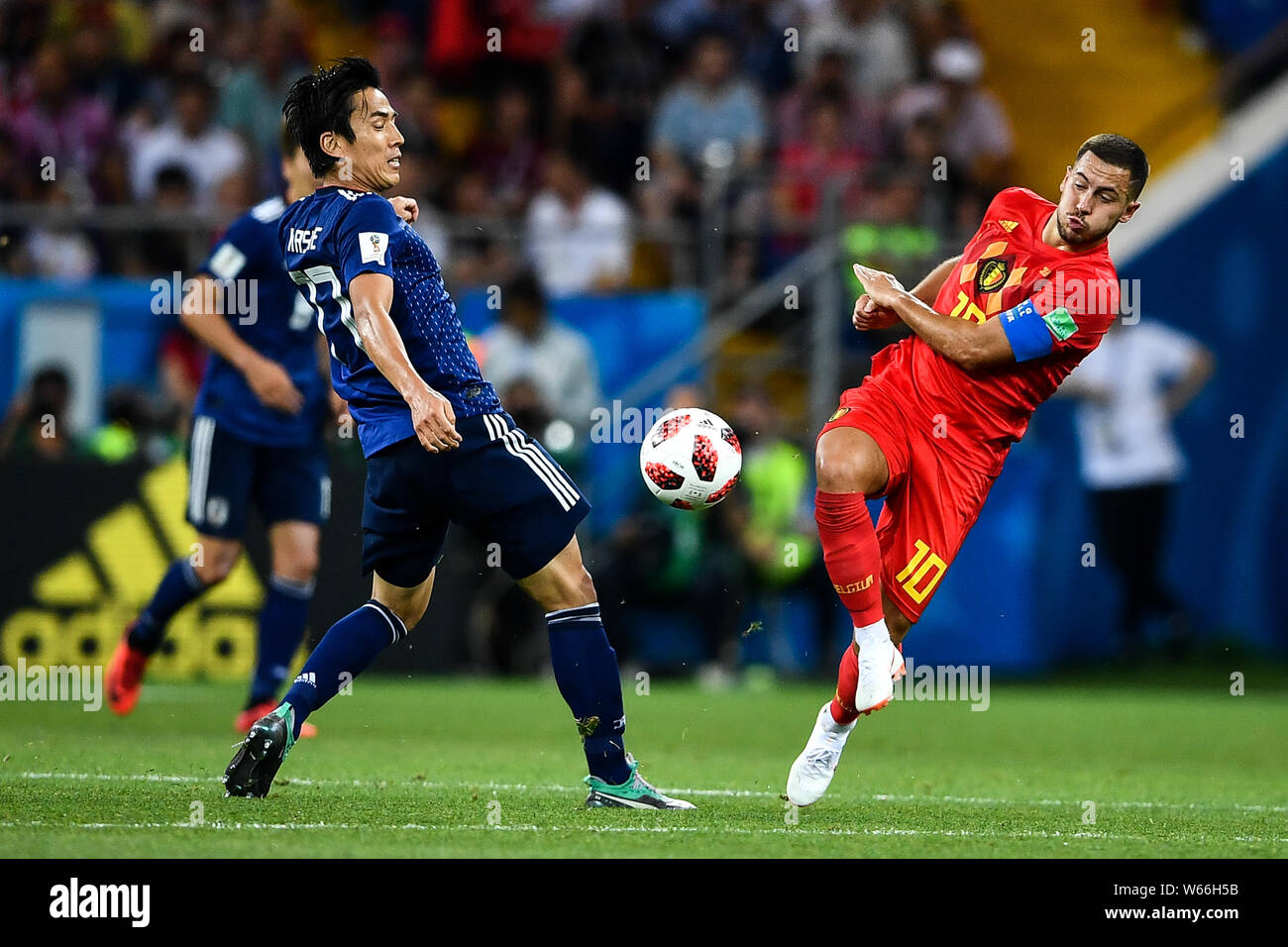 Eden Hazard of Belgium, right, challenges Makoto Hasebe of Japan in their Round of 16 match during the 2018 FIFA World Cup in Rostov, Russia, 2 July 2 Stock Photo
