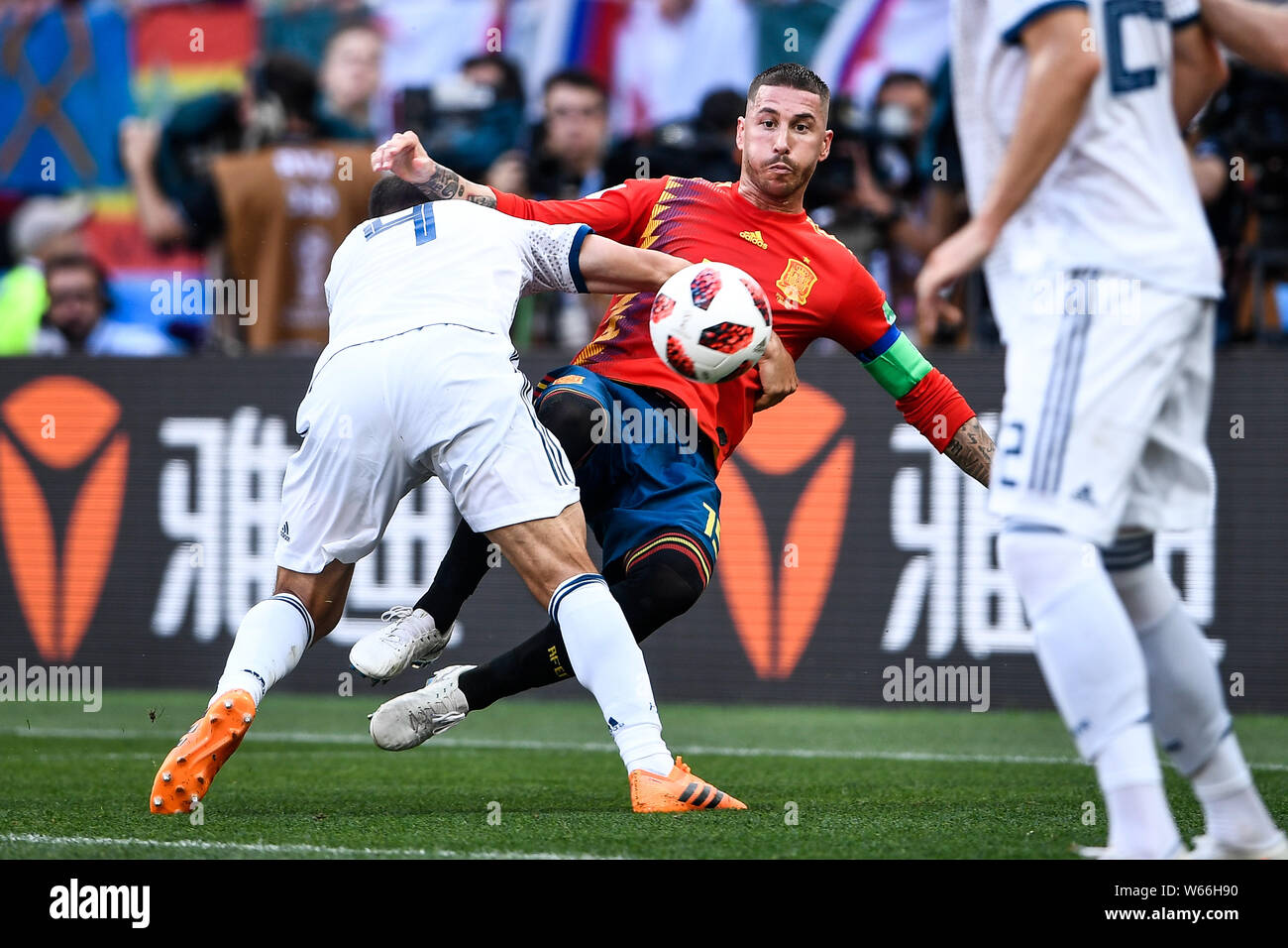 Sergei Ignashevich of Russia, left, challenges Sergio Ramos of Spain in their Round of 16 match during the 2018 FIFA World Cup in Moscow, Russia, 1 Ju Stock Photo