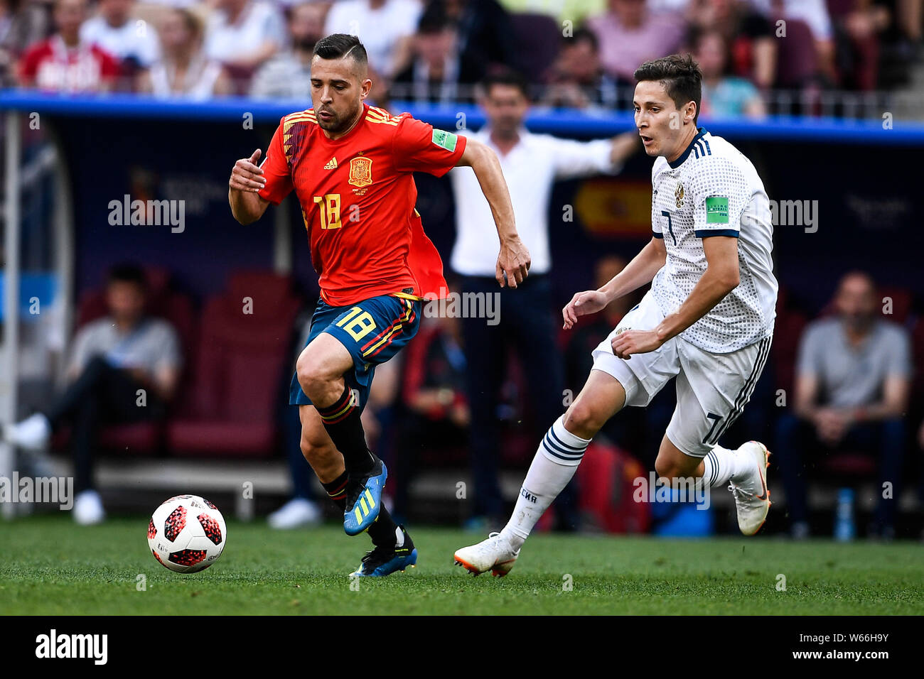 Daler Kuzyayev of Russia, right, challenges Jordi Alba of Spain in their Round of 16 match during the 2018 FIFA World Cup in Moscow, Russia, 1 July 20 Stock Photo