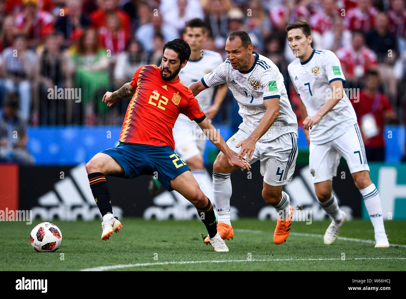 Sergei Ignashevich of Russia, right, challenges Isco of Spain in their Round of 16 match during the 2018 FIFA World Cup in Moscow, Russia, 1 July 2018 Stock Photo