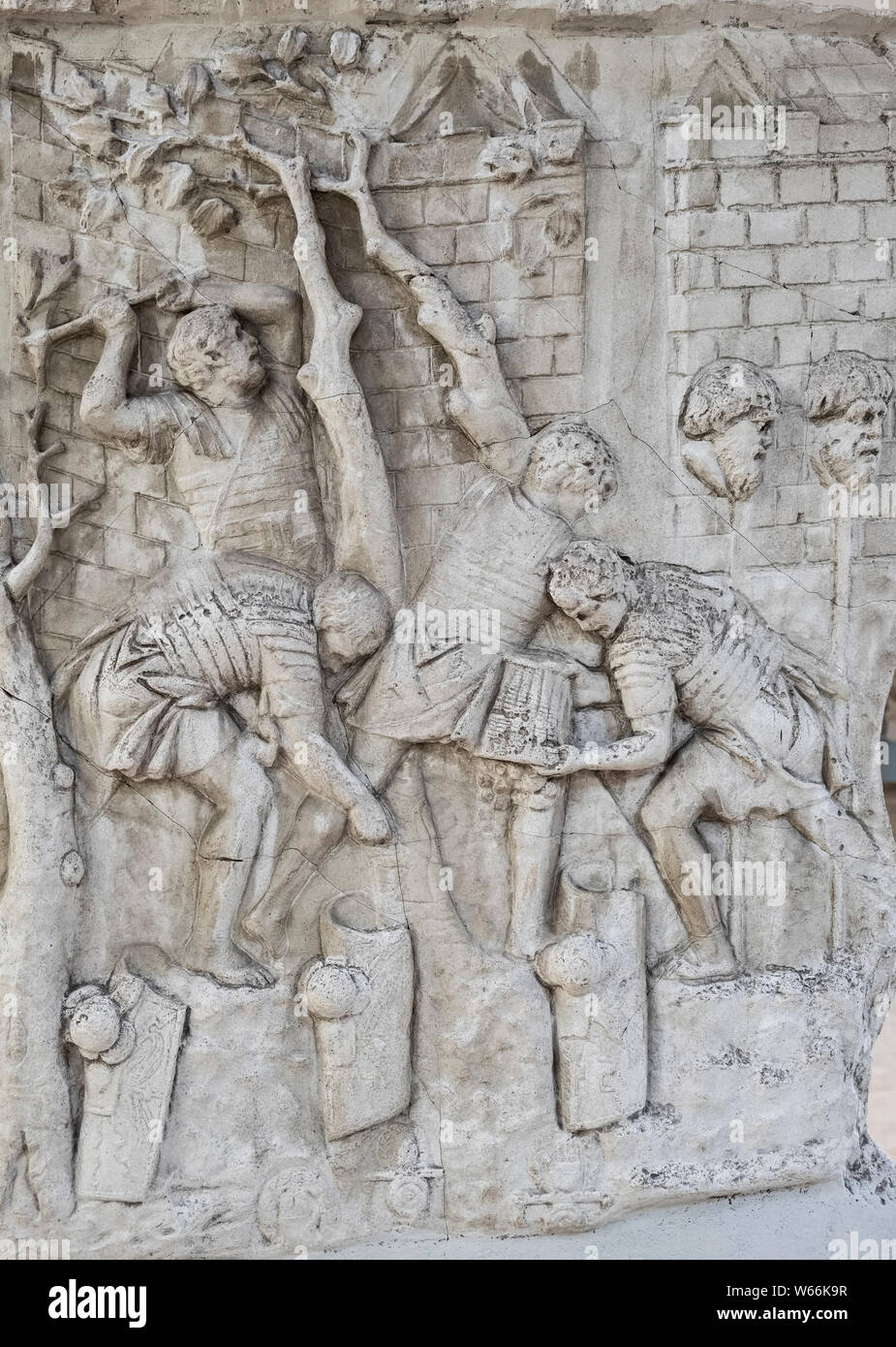 Detail from a 19c cast of Trajan's Column (AD 113) - Roman legionaries fell trees to build a road, beside the severed heads of Dacian tribal warriors Stock Photo