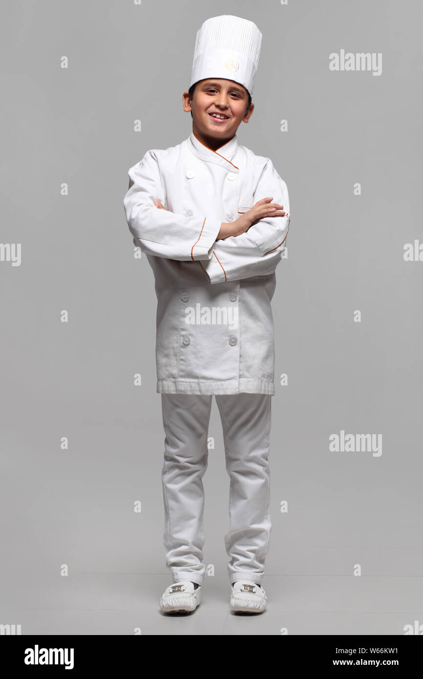 Boy pretending to be a chef and smiling Stock Photo